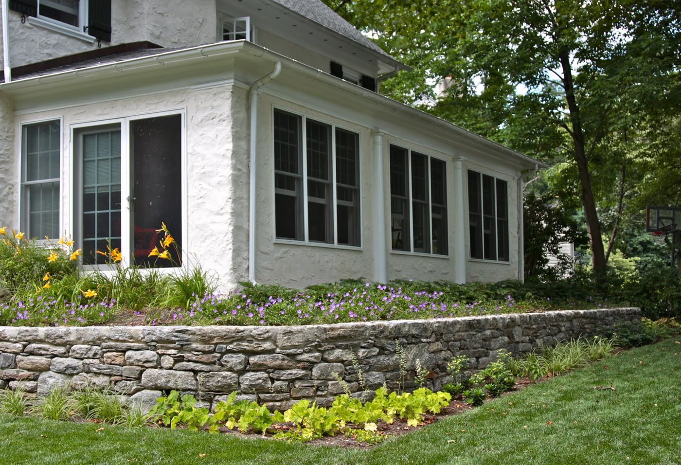 Perennial border planted above a stone retaining wall